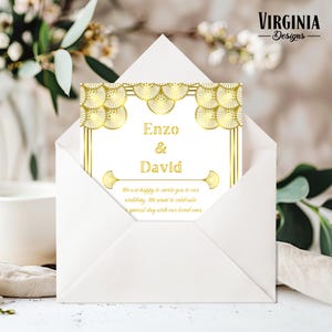 May include: A white wedding invitation card with gold art deco design is partially visible inside a white envelope. The card reads "Enzo & David" and includes text inviting guests to the wedding. The Virginia Designs logo is in the upper right corner.