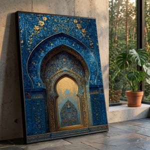 May include: A framed canvas print featuring an ornate archway design. The artwork showcases a rich blue and gold color palette with intricate floral and geometric patterns. The print is leaning against a concrete wall near a window.