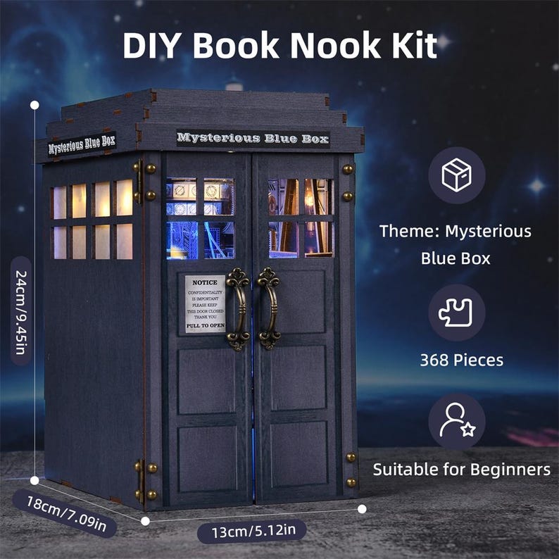 May include: A DIY Book Nook Kit, themed "Mysterious Blue Box", features a dark blue wooden structure with dimensions of 9.45 inches high, 7.09 inches wide, and 5.12 inches deep. The kit includes 368 pieces and is suitable for beginners. The text "Mysterious Blue Box" is visible.