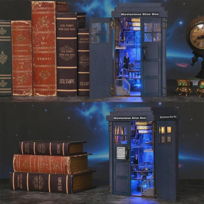 May include: A miniature blue police box with the text "Mysterious Blue Box" on top, with the door open to reveal a detailed interior with a figure. Books with "Sample Text" and "Flower" are on the left.