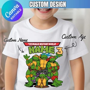 May include: White t-shirt featuring a Teenage Mutant Ninja Turtles graphic. The design includes the words "NAME" and "3", with space for a custom name and age. The shirt has a Canva editable design.