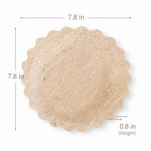 May include: A beige, round plate with a scalloped edge. The plate is 19.8 cm in diameter and 2 cm high. The plate has a textured surface and is made of stone.