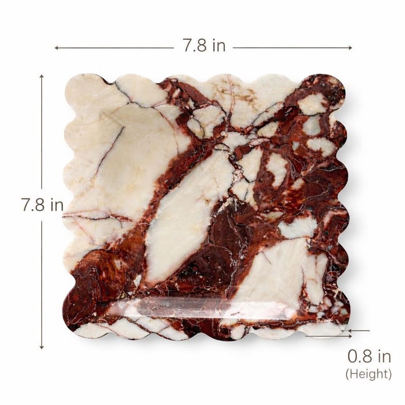May include: A square marble tray with a wavy edge, measuring 19.8 cm on each side and 2 cm in height. The tray features a cream-colored background with striking red and brown veining throughout.