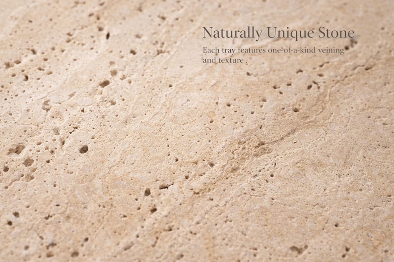 May include: Close-up of a light beige stone surface with a unique texture and veining. The image includes the text "Naturally Unique Stone" and "Each tray features one-of-a-kind veining and texture."