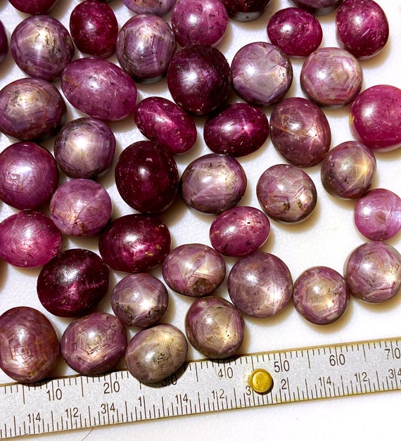 1 piece Star Ruby cabochon randomly picked from a lot - 6 - 15 carat each - natural - old stock India material - great stars