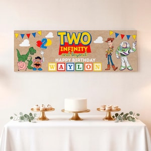 May include: A rectangular birthday banner featuring Toy Story characters including Rex, Hamm, Mr. Potato Head, Woody, and Buzz Lightyear. The text reads TWO INFINITY and beyond HAPPY BIRTHDAY WAYLON with colorful bunting and balloons on a tan background.