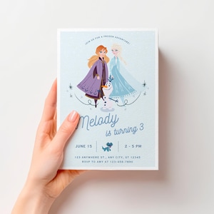 May include: A light blue rectangular invitation card featuring illustrations of Anna, Elsa, and Olaf. The text reads: Join us for a frozen adventure! Melody is turning 3, June 15, 2-5 PM, 123 Anywhere St., Any City, ST 12345, RSVP to Amy at 123-456-7890.
