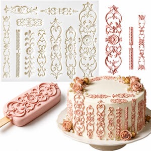 May include: A white silicone mold featuring various intricate scrollwork and floral relief patterns. Beside the mold are three pink decorative pieces, a pink popsicle-shaped treat, and a white cake, all adorned with matching embossed designs.