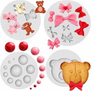 May include: Four white silicone molds for crafting, featuring shapes of teddy bears, various bows, and spheres of different sizes. The set includes finished examples of light pink, brown, and red resin or clay figures and a baked bear-shaped cookie.