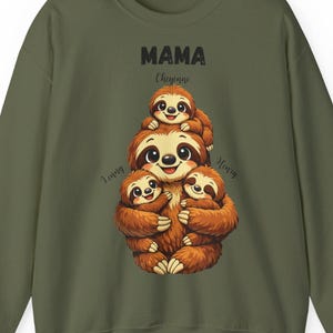 May include: Olive green sweatshirt featuring a graphic of a mother sloth with three baby sloths stacked on top of each other. The word "MAMA" is above the sloths, with the name "Cheyenne" below it. The words "Loving" and "Happy" are on either side.