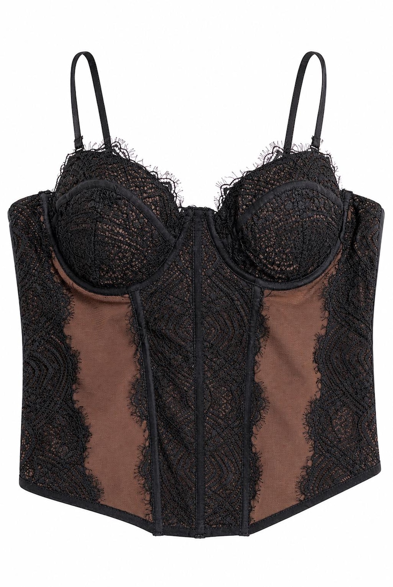 May include: Black lace bustier with adjustable straps. The bustier features a sheer brown panel in the center and sides, with intricate lace detailing and scalloped edges. A classic lingerie piece.