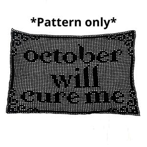 May include: Black crocheted rectangular pattern with the text "October will cure me". The pattern is surrounded by a decorative border and the text "*Pattern only*" is at the top. The pattern is on a white background.