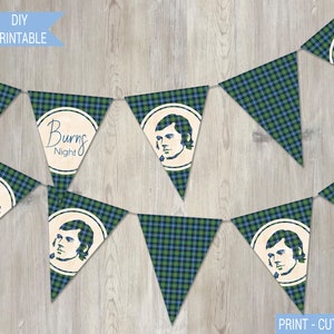 May include: A printable banner with a green and blue plaid pattern. The banner has alternating flags with the text "Burns Night" and a portrait of a man. The text "PRINT - CUT - CREATE" is at the bottom of the image.
