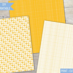 May include: Two printable digital paper designs in yellow and white. One design features a repeating pattern of small yellow circles on a white background. The other design features a repeating pattern of thin yellow lines on a white background. The text "PRINT - CUT - CREATE" is visible at the bottom of the image.