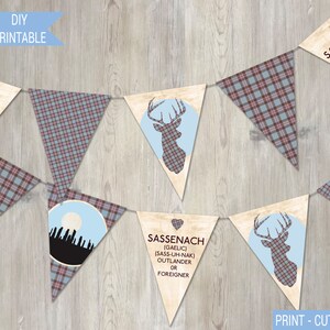 May include: A printable banner with a Scottish theme. The banner features a variety of designs, including a stag, a plaid pattern, and the text "Keep Calm and Dinna Fash". The banner also includes the word "Sassenach" with the Gaelic pronunciation and definition.