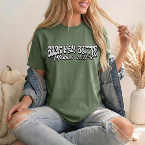 May include: A rustic wooden sign with the text "Welcome" in a handwritten style. The sign is painted white with a distressed finish, and a small, decorative heart is attached to the bottom. The background is a blurred image of a wooden surface.