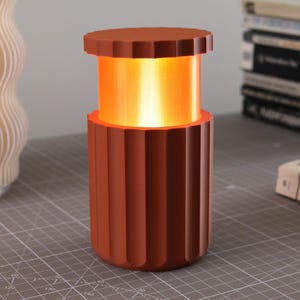 May include: A light blue blazer with a white and light blue patterned design. The blazer has a classic lapel and two front pockets. The fabric appears to be a lightweight material.