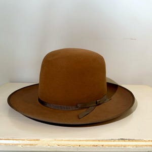 May include: A set of three ceramic mugs with a speckled, matte finish. The mugs are in shades of cream, light gray, and dark gray. Each mug has a simple, minimalist design, perfect for coffee or tea.