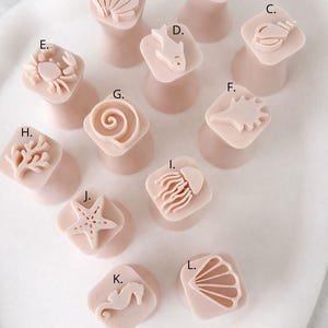 May include: A handmade, wooden serving tray with a natural finish. The tray features a rectangular shape with raised edges and integrated handles. The wood grain is visible, showcasing the tray's craftsmanship.