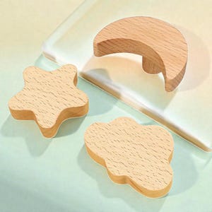 May include: A set of three ceramic mugs with a speckled, matte finish. The mugs are in shades of cream, light gray, and dark gray. Each mug has a simple, minimalist design, perfect for coffee or tea.