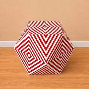 May include: A hexagonal ottoman featuring a bold geometric pattern of alternating red and white stripes. The stripes create a series of concentric squares and diamond shapes that converge toward the center of each visible panel on the object.