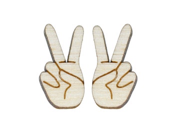 May include: Two wooden peace sign hand cutouts. The hand cutouts are light brown and have a natural wood grain.