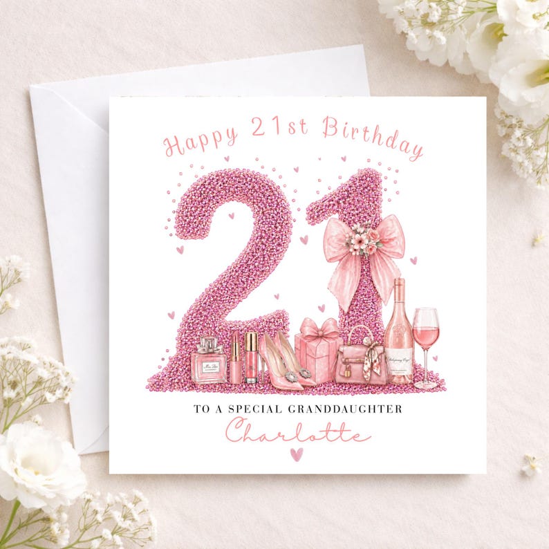 May include: A white greeting card with a pink glitter design that says "Happy 21st Birthday". The number "21" is in pink glitter, with illustrations of a perfume bottle, high heels, and a wine bottle.