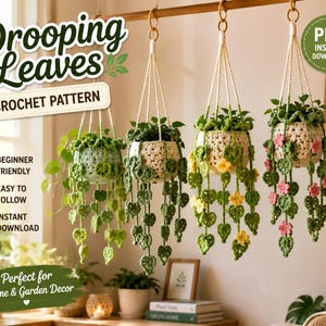May include: Four hanging crochet plant baskets with trailing green leaves and flowers. The text reads Drooping Leaves Crochet Pattern, Beginner Friendly, Easy to Follow, Instant Download, and PDF Instant Download. The baskets are suspended from a wooden rod.