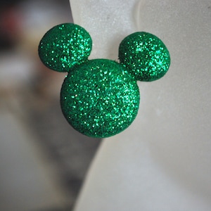 May include: Green glitter Mickey Mouse ears.
