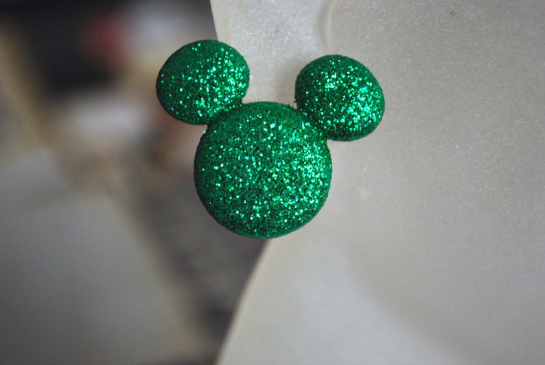 May include: Green glitter Mickey Mouse ears.