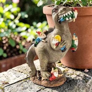 May include: A quirky garden ornament depicting a dinosaur with gnomes. The dinosaur's mouth is full of gnomes, and others are clinging to its body. A fun and unusual piece for a garden, adding a touch of humour.