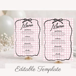 May include: Two pink and white gingham menu cards with black decorative borders and gold stands. The menu includes appetizers, entrees, desserts, and drinks. The text "Editable Template" is at the bottom.