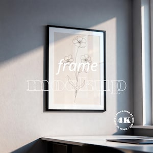 May include: A white ceramic mug with a black handle and the text "But First, Coffee" in a bold, black font. The mug is filled with a dark liquid, likely coffee, and sits on a light-colored surface.