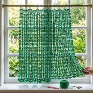 May include: A vibrant green crochet curtain featuring a repeating leaf pattern, suspended from a brass rod with matching rings. The intricate openwork design showcases a delicate, interconnected foliage motif that hangs vertically across the window.