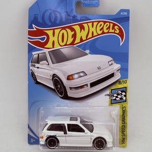 May include: A white Hot Wheels Honda Civic Si die-cast toy car in its original blue and yellow blister pack packaging. The card features the Hot Wheels logo, the text Guaranteed For Life, 4/250, 8/10, and HW Speed Graphics. The car has black wheels.