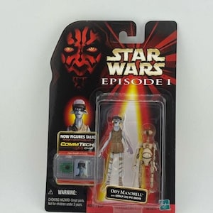 May include: Star Wars Episode I action figure set featuring Ody Mandrell and a 222 Pit Droid. The packaging includes a CommTech chip and a warning about small parts. The background features Darth Maul's face and the Star Wars logo.