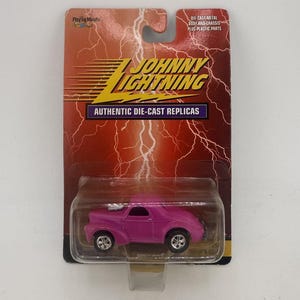 Johnny Lightning 1/64 – Studebaker Pickup Surf Rods 2001 (NG82, Occasion, Blister)