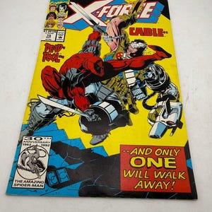 May include: A comic book cover featuring Deadpool and Cable in action, set against a yellow background. The cover includes the text "X-FORCE" and "CABLE," along with the phrase "AND ONLY ONE WILL WALK AWAY!" The Amazing Spider-Man logo is also visible.
