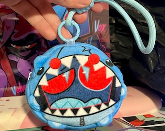 Monedero de peluche Vox con diseño de tiburón