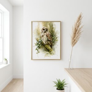 Watercolor owl wall art printable displayed in gold frame on white wall in Scandinavian boho room with pampas grass and fern, instant digital download nature art for modern minimalist home decor