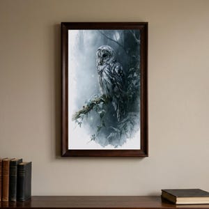 Barred owl watercolor printable wall art in dark walnut frame on neutral wall above wooden shelf with vintage books, moody cottagecore dark academia home decor digital download print