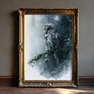 Barred owl watercolor printable wall art displayed in an ornate gold baroque frame leaning against a gray wall on herringbone wood floor, moody dark cottagecore forest bird art print, instant digital download