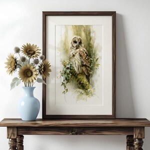 Framed watercolor owl printable art leaning on rustic wood console table with blue vase and dried sunflowers, cottagecore farmhouse home decor, instant digital download wall art print