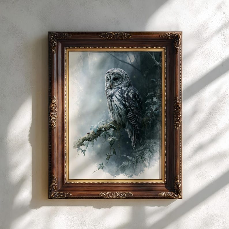 Barred owl watercolor printable wall art displayed in an ornate dark walnut and gold decorative frame on a neutral textured wall with soft natural window light shadows, moody cottagecore woodland aesthetic
