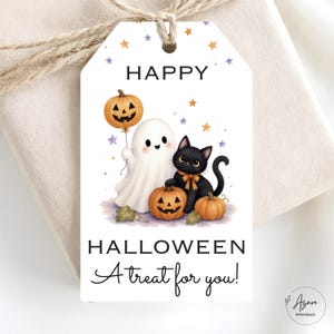 May include: A rectangular white gift tag featuring the text HAPPY HALLOWEEN A treat for you! The illustration shows a white ghost holding a pumpkin balloon, a black cat with an orange bow, and two pumpkins, all surrounded by small purple and orange stars.