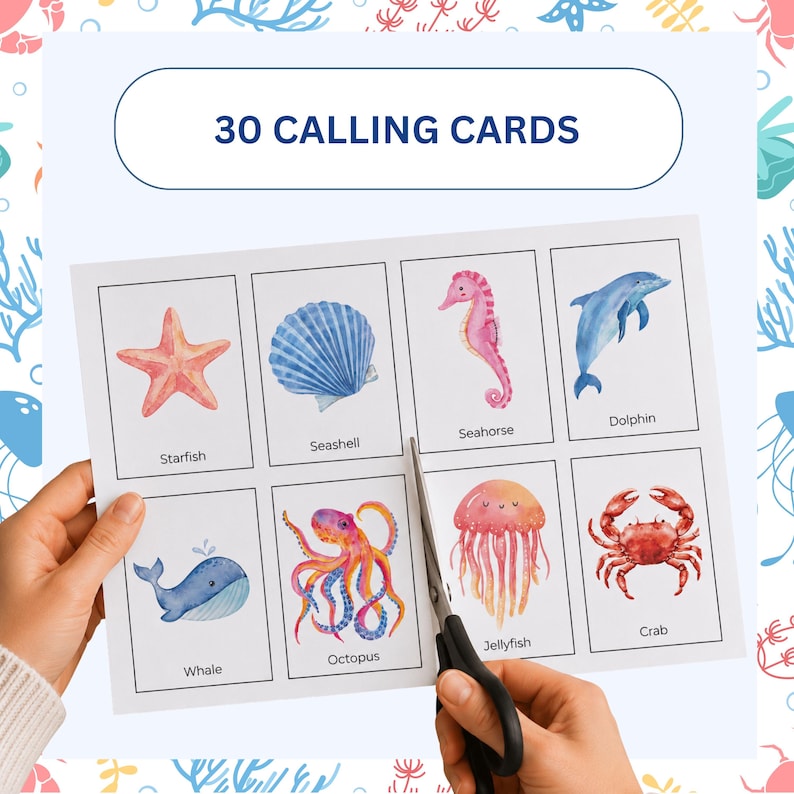 May include: A sheet of 30 calling cards featuring watercolor illustrations of marine life, including a starfish, seashell, seahorse, dolphin, whale, octopus, jellyfish, and crab. The cards are being cut with scissors.