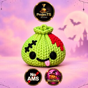 May include: A lime green, round, textured 3D printed object resembling a drawstring pouch with a stitched black scar, a red patch, two black circular eyes, and a small pink tongue sticking out. The object features the text ProjectTS 3D Print.