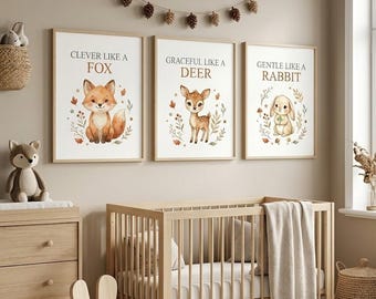 May include: A set of three framed wall art prints featuring illustrations of a fox, a deer, and a rabbit with the text Clever like a fox, Graceful like a deer, and Gentle like a rabbit, displayed above a wooden crib in a neutral-toned room.