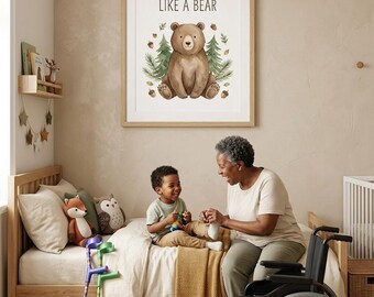 May include: A framed wall art print featuring a brown bear illustration surrounded by green pine trees and brown acorns, with the text STRONG LIKE A BEAR printed in black above the bear. The artwork is displayed in a light wood frame.