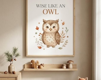 May include: A rectangular wall art print in a light wood frame featuring a brown owl illustration centered above the text WISE LIKE AN OWL. The design includes small autumn leaves, berries, and stars in muted earth tones on a white background.
